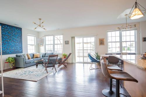 a living room with a couch and a table at NEW Luxury Quiet Island Atlantic City Getaway in Atlantic City