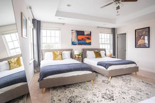a bedroom with two beds and a rug at NEW Luxury Quiet Island Atlantic City Getaway in Atlantic City
