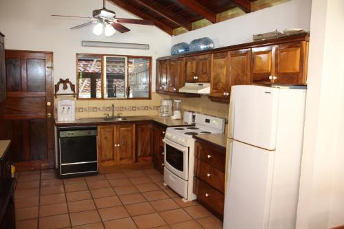 A kitchen or kitchenette at Ocotal Beach Front House #25