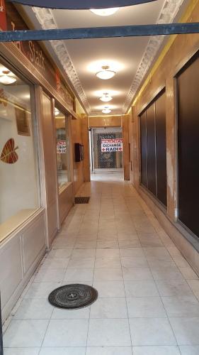 a hallway of a building with a drain in the floor at Jolie in Belgrade