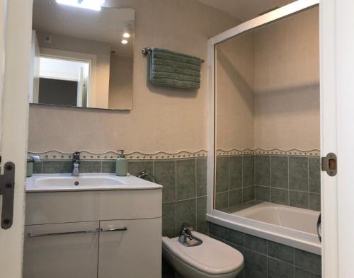 a bathroom with a sink and a tub and a toilet at Penthouse La Paz 9 - Castle view in Moraira