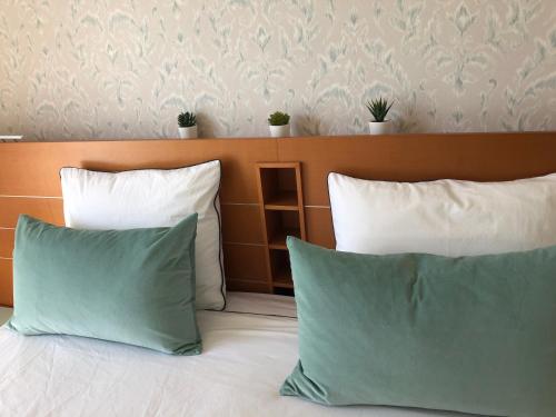 two pillows are sitting on a bed next to sidx sidx at Penthouse La Paz 9 - Castle view in Moraira