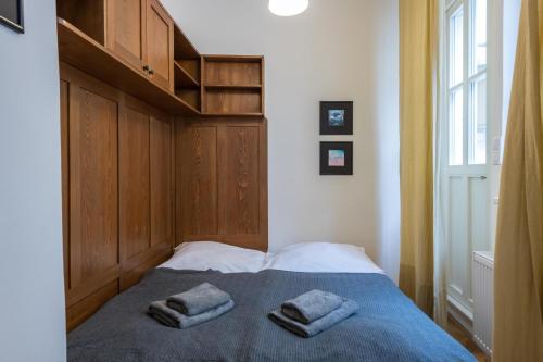 Postel nebo postele na pokoji v ubytování Apartman Carolinum