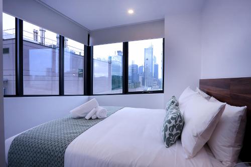 Ένα ή περισσότερα κρεβάτια σε δωμάτιο στο Flagstaff Green Apartments