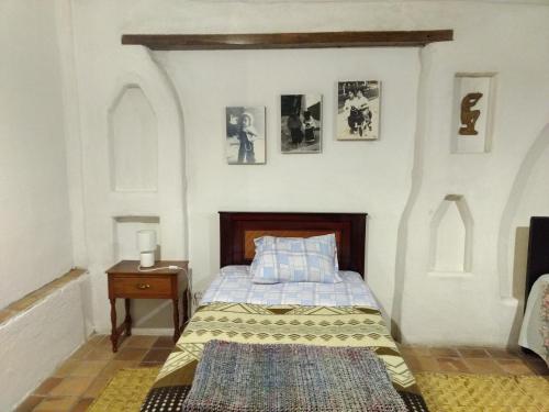 מיטה או מיטות בחדר ב-Aylluwasi Guesthouse