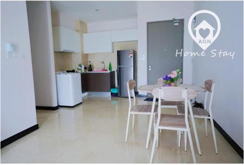 a kitchen with a table and chairs in a room at AMAZING SEAVIEW @ SILVERSCAPE in Melaka