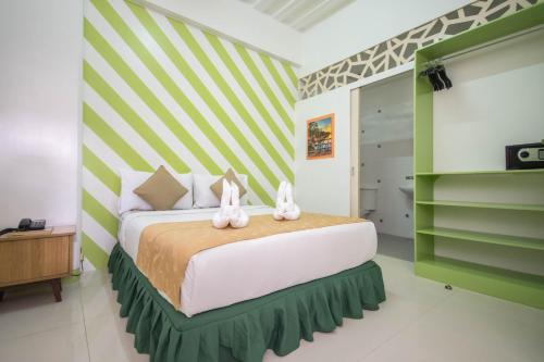 Postel nebo postele na pokoji v ubytování Alicia Tower Residences