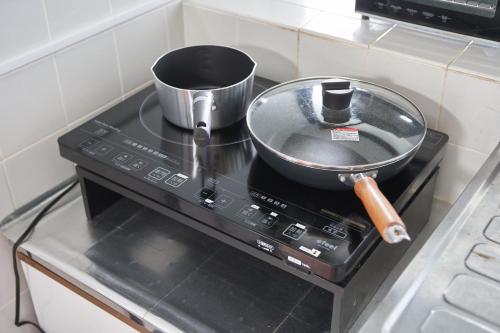 a pot on top of a stove in a kitchen at Wind Henza in Henza