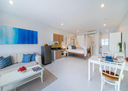 a living room with a couch and a table at Blu Marine Hua Hin Resort and Villas in Hua Hin