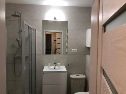 Kúpeľňa v ubytovaní Wislane Tarasy 2.0 by Atrium Apartments