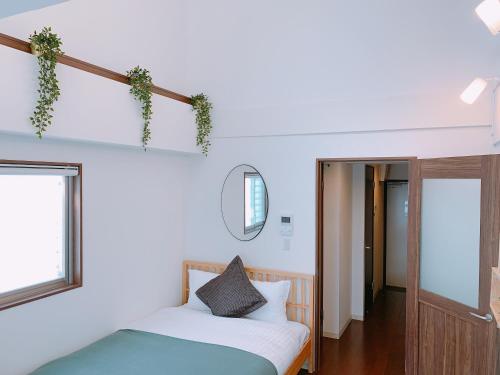 Ένα ή περισσότερα κρεβάτια σε δωμάτιο στο Dash Living Higashi Azabu