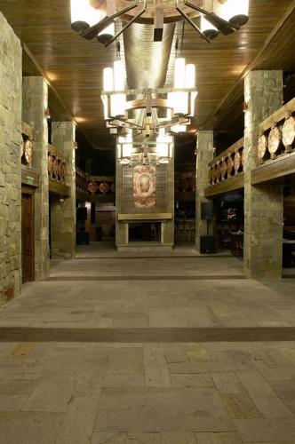 a large building with a large room with a large ceiling at Gardenia Park Hotel in Bansko