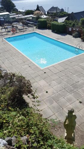 a large swimming pool with a fire hydrant next to it at Hendre Coed Isaf static caravan Barmouth in Barmouth