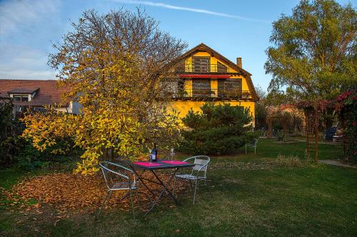 a table and chairs in front of a house at Villa Umberti in Sibiu