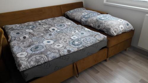 Postel nebo postele na pokoji v ubytování 1+1 Znojmo