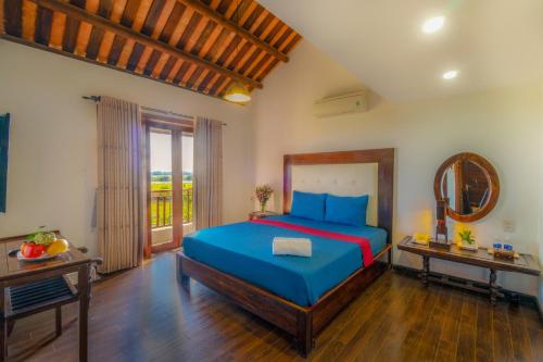 Llit o llits en una habitació de Calm House Hotel Hoi An 1