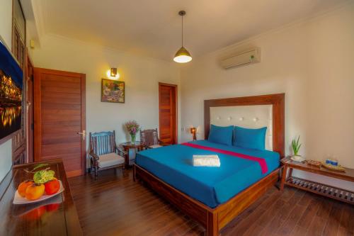 Postel nebo postele na pokoji v ubytování Calm House Hotel Hoi An 1