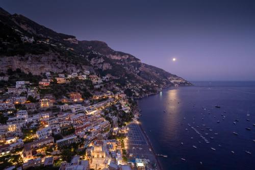 an aerial view of the amalfi coast at night at Hotel Villa Franca in Positano