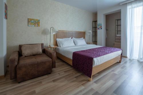Postel nebo postele na pokoji v ubytování Ornament Boutique Hotel