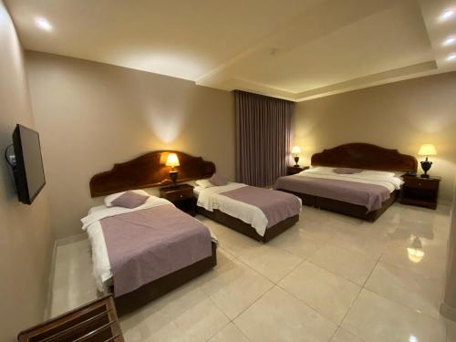 Katil atau katil-katil dalam bilik di Mosaic City Hotel