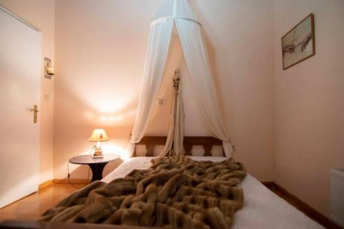 a bedroom with a bed with a blanket on it at Traditional Stone Home with view in Throfárion
