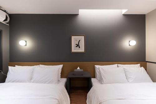 Katil atau katil-katil dalam bilik di Brown Dot Hotel Seong Seo