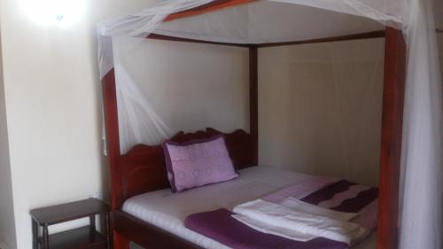 Кровать или кровати в номере Dubai Resort Hotel