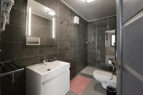 Koupelna v ubytování HR Apartmanház