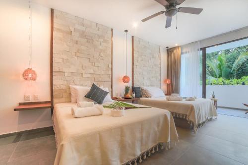 Postel nebo postele na pokoji v ubytování Hotel Blanco Tulum Adults Only