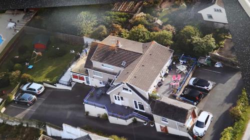 an aerial view of a house with a garage at Bacchus in Mevagissey