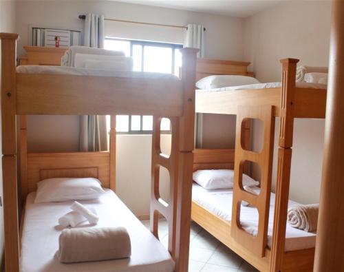 Двухъярусная кровать или двухъярусные кровати в номере APARTAMENTO 3 dormitorio VISTA PARA MAR