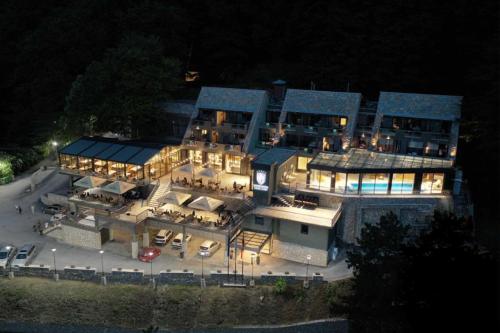 an aerial view of a large mansion at night at Panorama Hotel & Spa in Kruševo