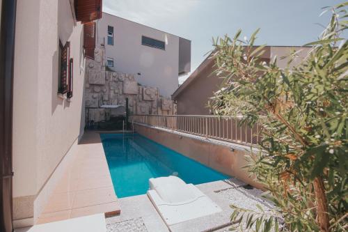 a swimming pool in the middle of a building at Apartment Patricia in Rab