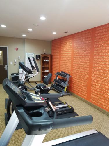 a gym with several tread machines in a room at La Quinta by Wyndham Atlanta Union City in Union City