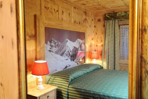 Letto o letti in una camera di Hotel Alpina