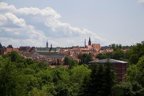 a view of a city with buildings and trees at Penzion Na Svahu in Cheb