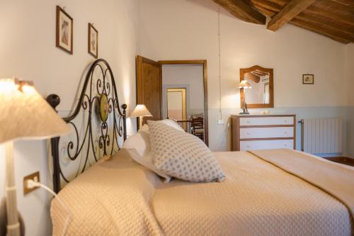 Ένα ή περισσότερα κρεβάτια σε δωμάτιο στο Agriturismo Canale