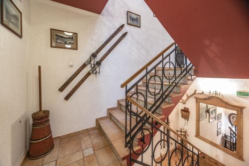 a spiral staircase in a home with a stair case at Hotel Resort Martin & Kristyna in Špindlerův Mlýn
