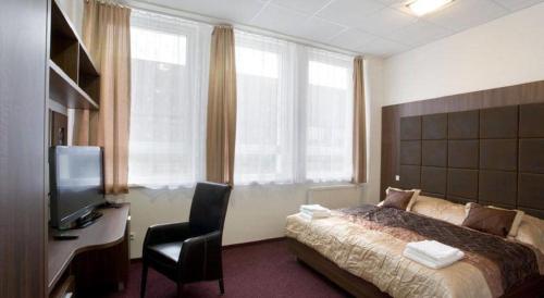 Postel nebo postele na pokoji v ubytování Hotel Branč, Garni