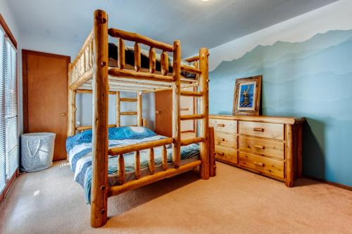 a bedroom with a bunk bed and a dresser at Mount Royal Townhome in Frisco