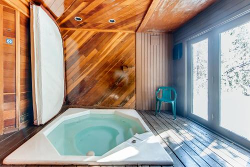 a jacuzzi tub in a room with a wooden ceiling at Mount Royal Townhome in Frisco