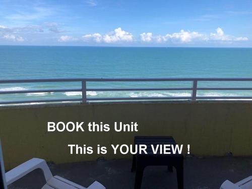 a sign that reads book this unit this is your view of the ocean at Ocean Walk Resort - Dramatic Ocean Front View in Daytona Beach