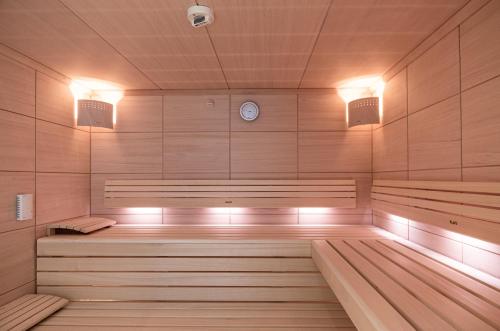 an empty sauna with a clock on the wall at Hotel Spiess & Spiess in Vienna