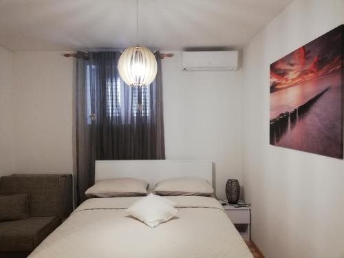 Postel nebo postele na pokoji v ubytování Studio Apartman Lenka
