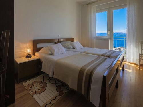 Postel nebo postele na pokoji v ubytování Apartments STIPE