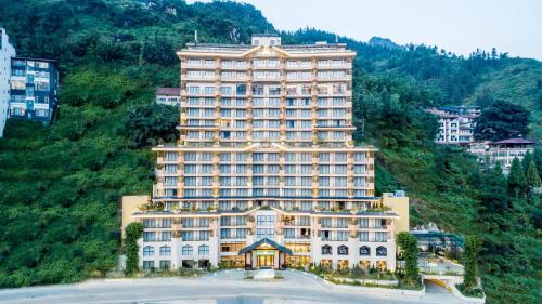 a large building on top of a mountain at KK Sapa Hotel in Sa Pa