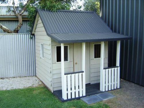 a small play house with a black roof at Moontana in Port Moonta