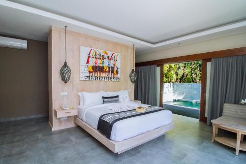 a bedroom with a large white bed and a pool at Ubud Hills Villas & Resort in Ubud