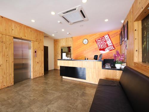 a hotel lobby with a counter and a counter top at RS Boutique Hotel in Kluang