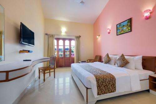 Postel nebo postele na pokoji v ubytování Spazio Leisure Resort, Goa